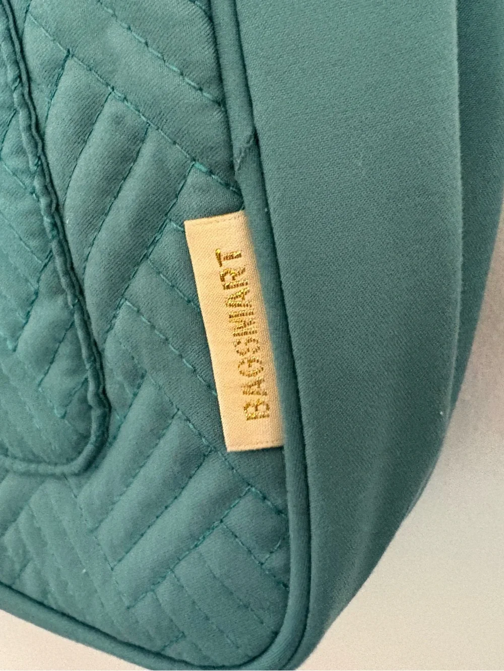 Teal Bagsmart quilted hanging travel toiletry bag